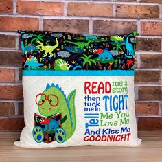 Sewing Easter Projects, Dinosaur Reading, Pillow With Pocket, Reading Pillows, Front Pocket Design, Holding A Book, Name Covers, Commercial Embroidery Machine, Sewing Creations