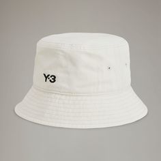 adidas Shop the Y-3 Bucket Hat - Black at adidas.com/us! See all the styles and colors of Y-3 Bucket Hat - Black at the official adidas online shop. Adidas Sporty Hat For Streetwear, Adidas Sporty Streetwear Hats, Sporty Adidas Hats For Streetwear, Adidas Cotton Hats For Summer, Adidas Cotton Summer Hats, Sporty Short Brim Hat For Streetwear, Adidas Hats For Streetwear, Sporty Bucket Hat With Curved Brim, Adidas Hats For Summer Streetwear