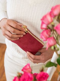 Made with a red sueded fabric, lined with a bird print cotton, and finished with a brown suede zipper pull, you'll adore this sweet and stylish little pouch. These purses are a perfect size for little things, like credit cards and cash. Your undersized items can tuck in here, and fit into a bigger purse or pocket. The sturdy brass zippers make them easy to use. 5.5" X 3.75" Designed and handmade at the Ash & Rose studio in Massachusetts Limited edition Red Bag With Zipper Pocket For Gift, Everyday Red Pouch Cosmetic Bag, Red Cosmetic Bag With Zipper Closure - Gift, Red Cosmetic Bag With Removable Pouch As Gift, Red Wallet With Zipper Pocket For Everyday Use, Gift-ready Red Cosmetic Bag With Removable Pouch, Red Coin Purse With Removable Pouch As Gift, Red Coin Purse With Removable Pouch For Gift, Red Coin Purse Pouch For Gift