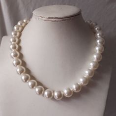 Welcome back to my shop: https://www.etsy.com/shop/pearlandjewelry Description of the product in the picture: This necklace with  14 mm  ivory color plastics pearl beads. The length of the necklace is 18 inches.You can choose the length when you order.and the necklace with a lobster clasp and it still has a 2 inch long adjustable chain. If you need the other lengh or size ,Please feel free contact me. Thank you so much, :) Cheap Vintage Pearl White Necklace, Big Beads Necklace, Rocky Horror Picture Show Costume, Fake Pearl Necklace, Gyaru Hair, Big Pearl Necklace, Pearl Necklace Choker, Necklace Big, Pearl Necklace Wedding