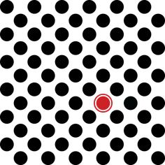 a red dot is in the middle of black and white circles