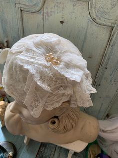 "Beautiful hat of antic lace. With a corsage, also from old lace with pearls. It is a nice , easy wearing model. Middle size Hand made Silk inside Still in perfect condition From France Also nice hanging on an old \"regale\"" Fitted Vintage Bonnet With Lace Trim, Elegant Lace Bonnet With Lace Trim, Elegant Wedding Bonnet, Vintage Cloche Fascinator For Wedding, Vintage White Bonnet For Wedding, Fitted Vintage Bonnet For Wedding, Vintage Wedding Bonnet With Lace Trim, Wedding Bonnet With Lace Trim, Vintage White Wedding Bonnet