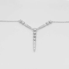 Metal Quality: 14k White Gold Diamond Shape: Round Diamond Total Weight: .74 Carats Diamond Clarity: SI 1 (Excellent) Diamond Color: G (Excellent, Near Colorless) Short Station Lengths: 23.39 millimeters / .92 inches each Long Station Length: 29 millimeters / 1.14 inches Chain Type: Cable Chain Length: 18 inches Clasp: Lobster Clasp Chain Diameter: 1 millimeter Formal Fine Jewelry Lariat Pendant Necklace, Formal Fine Jewelry Lariat Necklace With Pendant, Formal Fine Jewelry Lariat Necklace, Formal White Gold Lariat Jewelry, Formal White Gold Lariat Diamond Necklace, Formal White Gold Lariat Necklace, White Gold Lariat Diamond Necklace For Formal Occasions, Timeless White Gold Lariat Necklace For Formal Occasions, Timeless White Gold Lariat Necklace For Formal Events