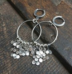 "Handmade earrings made of oxidized 925 silver with leaves. The earrings are made of 925 sterling silver. Silver is oxidized, rubbed and polished. Rim diameter - 1\" (2.5 cm). Length of earrings - 2.5\" (6 cm). You can choose your favorite type of fastener from the following options: hoop, leverback, hook and stick. We send jewelry in an elegant box.. Thank you for visiting Treendystudio!" Handmade Silver Metal Hoop Earrings, Silver Hand Forged Dangle Hoop Earrings, Silver Dangle Hoop Earrings Hand Forged, Hand Forged Small Hoop Silver Earrings, Silver Hand Forged Hoop Earrings, Silver Hand Forged Small Hoop Earrings, Handmade Silver Round Hoop Earrings, Hand Forged Teardrop Silver Hoop Earrings, Silver Teardrop Hand-forged Hoop Earrings