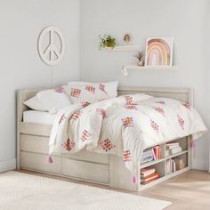 a bed sitting in a bedroom next to a book shelf