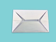 an origami envelope on a blue background