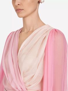 This Two-Tone Chiffon Blouse from Dolce & Gabbana is made of lightweight silk, providing a breathable, comfortable fit. Its crossed closure creates sensual finish, while delicate degradé pink nuances add romantic touch. Enjoy effortless style all day long with sophisticated piece. Elegant Pink Blouse With Sheer Sleeves, Feminine Silk Chiffon Blouse For Spring, Feminine Silk Chiffon Blouse For Summer, Elegant Pink Blouse With Blouson Sleeves, Feminine Silk Tops With Sheer Sleeves, Feminine Silk Top With Sheer Sleeves, Elegant Pink Chiffon Top, Spring Evening Silk Chiffon Blouse, Elegant Summer Georgette Blouse