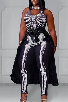 a woman in skeleton print clothing poses for the camera with her hands on her hips