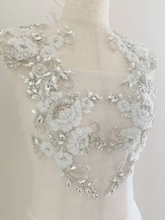 Gorgeous wedding / bridal applique with high quality, genuine crystal rhinestones, crystals, beads, rhinestones and beads are all hand sewn . Delicate bridal applique , dotted with silver rhinestone ,beads , pearls and crystals. with large beads in the center , perfect for bridal sash, belts, wedding accessories, bridal head piece etc PLEASE NOTE THE F1ST-3RD PICTURE IS WITH TWO PAIRS, 4TH-10TH PICTURE IS FOR ONE PAIR size: Price is for one piece, . more in stock ~ Please this is only applique, White Bridal Belt With Rhinestones For Party, White Rhinestone Bridal Belt For Party, Wedding Lace Fabric With Rhinestones, Glamorous White Sequin Fabric With Rhinestones, Embellished White Lace Bridal Belt, White Crystal Bridal Belt With Rhinestones, White Embellished Lace Bridal Belt, Crystal Bodice Applique, Luxury White Appliques Embellishments