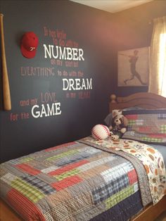 a bedroom with a baseball theme painted on the wall