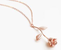 This standard single charm necklace is featured in rose gold tone and is available with a size 20" chain. Rose Gold Charm Necklace With Flower Pendant, Valentine's Day Rose Gold Necklaces With Rose Design, Dainty Rose Gold Charm Necklace With Rose Design, Rose Gold Flower Pendant Charm Necklace For Valentine's Day, Single Rose, Size 20, Charm Necklace, Gold Tones, Rose Gold