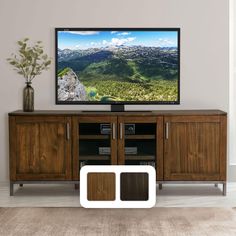 a large flat screen tv sitting on top of a wooden cabinet in a living room