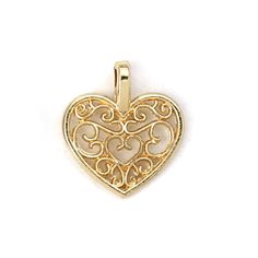 a heart shaped pendant with filigrees and scrolls on the front, in yellow gold