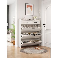 a shoe rack in the corner of a room with a rug on the floor next to it