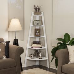 a living room filled with furniture and a tall white shelf