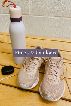 a pair of running shoes next to a water bottle on a wooden bench with the words fitness and outdoorss above it