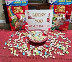 lucky you are back cereal sitting on top of a table next to two boxes of lucky charms