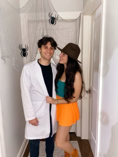 a man and woman dressed up in halloween costumes