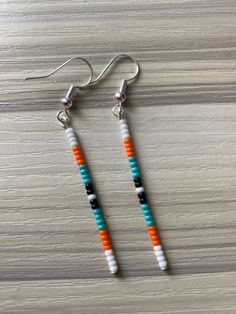 Dangle seed bead earrings Colorful Dangle Beaded Earrings, Minimalist White Beaded Dangle Earrings, Heishi Beads Earrings For Gifts, Minimalist Handmade Beaded Dangle Earrings, Handmade Minimalist Beaded Dangle Earrings, Heishi Beads Dangle Earrings, Minimalist Dangle Earrings With Tiny Beads, Minimalist White Beaded Earrings With Tiny Beads, Colorful Heishi Bead Dangle Earrings