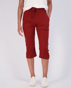 DESIGN: Our Women's Soft Capri Joggers are designed with a trendy and modern twist, featuring a cuff hem and a drawstring waist that provides the perfect fit for any size. The wide leg and cuffed hem make these joggers perfect for a range of activities from running, yoga, to lounging at home. BENEFITS: Whether you're looking for Women Running Bottoms for your active lifestyle or just comfortable pants to wear at home, our Capri Joggers have got you covered. Made from soft and warm material, thes Casual Elastic Waistband Knee-length Capris, Fall Cropped Leg Capris With Elastic Waistband, Sporty Summer Capris With Elastic Waistband, Knee-length Solid Bottoms With Drawstring, Knee-length Drawstring Solid Bottoms, Relaxed Fit Capris For Fall, Sporty Cotton Capris, Casual Knee-length Capris For Fall, Open Bottom Sweatpants