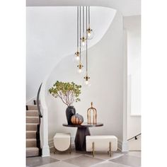 an elegant foyer with marble flooring and white walls