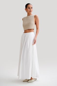 The crop. The GIANNI is a crop top cut with a boatneck design. Crafted from a sleek knitted fabrication, it's perfect for layering or wearing on its own. Tailored to a cropped length, this top accentuates your waistline and pairs beautifully with high-waisted jeans or pair with the Clarence Linen A-Line Maxi Skirt to complete the look. Sleeveless Knit Top, Engagement Party Wedding, Sleeveless Knit, White Midi Dress, Clothing Co, White Skirts, Full Skirt, Festival Outfits, High Waist Jeans