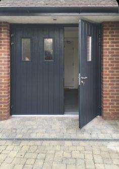 the entrance to a building with brick walls and doors