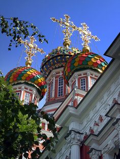 two colorful domes on top of a white building