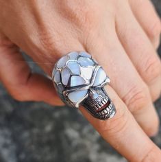 Handmade Exclusive Massive Skull Ring Pure 925 Sterling Silver with Natural Mother of pearl This beautiful Skull Ring has been Fabulously cast with .925 Sterling Silver and set with Hand Shaped Natural Mother of Pearl. The weight of this ring is 27 Grams The Ring size is 9 1/2 US. We will resize any size per your request. Please allow 2-3 weeks shipping as we are in Bangkok Thailand at this time We are a Los Angeles based company operating out of Thailand so that we may bring you the highest quality items at the most competitive prices. Just search and compare. We only offer authentic items. What we describe in our listings is 100% accurate and we encourage all of our customers to authenticate their purchases. USA please allow 14-21 business days Europe and U.K please allow 14-21 business White Sterling Silver Skull Jewelry, White Skull-shaped Sterling Silver Jewelry, Silver Skull Ring With Gemstone For Gift, Handmade White Gold Skull Ring Gift, Unique Silver Skull Ring Hallmarked, Handmade Skulls, Pearl Inlay, Skull Jewelry, Hand Shapes