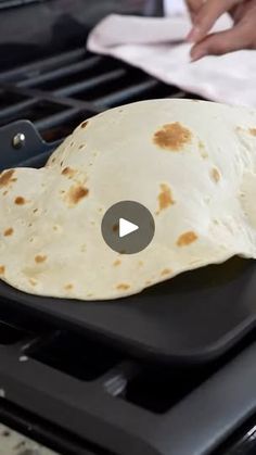 a tortilla sitting on top of an open grill