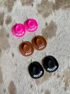 "Customize these adorable handmade mini cowboy hat earrings with your name or favorite phrase. Perfect for girls night, bachelorette parties, concerts, Nashville trips, or ANY occasion. Please make sure you add your personalization before checking out. Please limit a max of 8 letters (no numbers) per hat. Includes 1 pair of your favorite color cowboy hat earrings: Pink, White, Black or Brown The mini cowboy hat is made of a lightweight, durable plastic. The letters are white cirles with black wr Cowgirl Hat Earrings, Mini Cowboy Hats, Cowboy Hat Earrings, Trendy Personalized Adjustable Earrings, Trendy Adjustable Earrings For Birthday, Fun Adjustable Earrings For Birthday, Adjustable Western Jewelry For Party, Adjustable Western Style Party Jewelry, Adjustable Western Style Jewelry For Parties