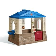 a toy house with a blue roof and red door