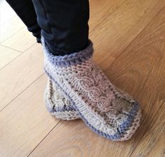 A beautiful pair of women's boot/knitted slippers. Made of 100 % wool yarn they are warm, cozy to wear and have a lot of bulk for extra comfort. Soles are covered with latex, which makes them not slippery to walk and give it a long life. Colors in picture - beige, grey. To make a slippers takes 3-5 days. If you want any other colors, please contact me. CARE: gently handwash in warm water, using a wool detergent. Reshape and let it dry. You will enjoy wearing wonderful warm slippers Crochet Slipper Boots, Slippers Socks, Slippers Crochet, Grey Slippers, Slippers Womens, Comfortable Slippers, Crochet Wool, Wool Slippers, Warm Slippers