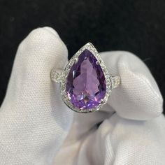 Natural Amethyst Pear Shape , 925 Sterling Silver Ring , CZ Around , Natural Amethyst Top Quality , Beautiful Wedding Amethyst Silver Ring Material - 925 Sterling Silver Center Stone :- Natural Amethyst  Quality - AAA+ Clarity - Loop Clean  Accent Stones - CZ Symbolism:- As the color purple has long been connected with royalty, amethysts were favored by the ruling class. Over time, amethysts have also come to be associated with spirituality, mental clarity, and healing. Amethyst is quartz in colors ranging from pale lilac to deep reddish purple. It has a relatively high hardness of 7, which means it's very scratch resistant. The February birthstone makes a fine gem for any kind of jewelry. Note: We use Good Quality Gemstone or 925 Solid Silver for This Amethyst Ring. Welcome to AQUAMARINE Wedding Amethyst Gemstones With Diamond Accents, Formal Pear-shaped Amethyst Ring With Prong Setting, Elegant Purple Teardrop Gemstone, Formal Teardrop Amethyst Ring In Fine Jewelry Style, Elegant Pear-shaped Amethyst Ring For Formal Occasions, Elegant Formal Pear-shaped Amethyst Ring, Elegant Teardrop Amethyst Gemstone Ring, Wedding Cubic Zirconia Gemstones, Elegant Silver Teardrop Amethyst Ring