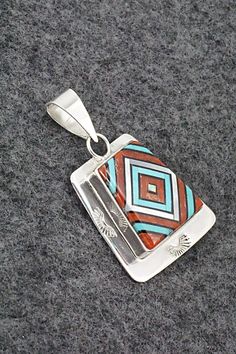 This beautiful turquoise, onyx, mother of pearl, coral and sterling silver inlay pendant and ring ring set was made by Zuni silversmith Vernon Vacit. The set is signed V. Vacit.Pendant Length: 1 1/2"Pendant Width: 1"Ring:Size: 9.5Length: 1 1/8"Width: 1/2"Free shipping on all orders! We ship with USPS and always include tracking. All orders ship within a day of payment.Returns are accepted up to 30 days after you receive your order. Just send us a message. Our shop offers cash back or store credi Artisan Red Jewelry With Inlay, Artisan Red Inlay Jewelry, Red Sterling Silver Jewelry With Inlay, Southwestern Silver Jewelry With Inlay, Southwestern Jewelry With Inlay For Gifts, Southwestern Style Jewelry With Inlay For Gift, Turquoise Inlay Jewelry As Gift, Southwestern Style Inlay Jewelry As Gift, Sterling Silver Artisan Jewelry With Inlay