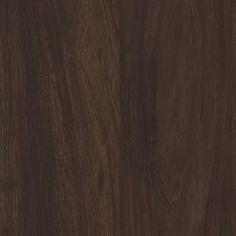 a close up view of the wood grains on this flooring material, which is dark brown