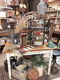 a room filled with lots of different types of furniture and decor on top of a rug