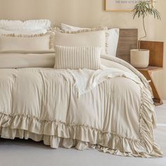 the comforter is made up with ruffles on it's edges and pillows