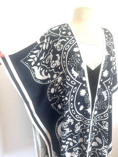 Black and white Kimono Cardigan, cover, with sleeves Very pretty feminine design on these Light weight and comfortable Fits size small to 2X Loose fitting Works great as a beach cover up or cardigan with jeans Black and white Kimono Cardigan, cover, with sleeves Black And White Kimono, Cardigan With Jeans, Gilet Kimono, White Kimono, Comfortable Fits, Cardigan Kimono, Pajama Robe, Kimono Cardigan, Womens Robes