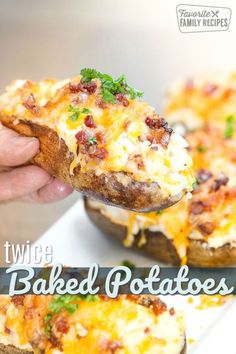 the baked potatoes have been topped with cheese and other toppings on them, while being held by a person