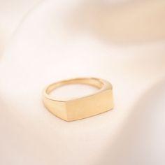 14k or 18k Solid Gold Rectangle Signet Ring For him or her. Male model is wearing a size 10. Face dimensions: 15mm x 6mm Built to last a lifetime and more. Complimentary custom engraving! Handmade to order. Please allow an additional three days for processing. 14k Yellow Gold Rectangular Jewelry, Gold Jewelry With Rectangular Polished Stone, Gold Jewelry With Polished Finish And Rectangular Stone, Modern Yellow Gold Recycled Signet Ring, Classic Rectangular Signet Ring Stamped 14k, Luxury Yellow Gold Rectangular Jewelry, Timeless Tarnish-resistant Rectangular Jewelry, Timeless Rectangular Jewelry For Wedding, Timeless Rectangular Wedding Jewelry