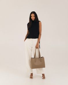 Polished work bag, meet casual weekend tote. Designed from the inside-out with a thoughtful system of interior pockets and card slots, and handcrafted in our supple, soft-yet-structured vegan ultrafiber leather. Fits 13-14” laptops (measured diagonally) with ease, and center divider means you can even carry two safely. Features a structured base that keeps the bag standing upright even when full, comfortable 2cm wide straps that won't dig into your shoulder, and a handy key leash to keep your ke Versatile Laptop Bag With Removable Pouch For Work, Modern Laptop Bag With Removable Pouch For Work, Rectangular Workwear Shoulder Bag With Interior Card Slots, Workwear Laptop Bag With Top Handle And Removable Pouch, Top Handle Laptop Bag With Removable Pouch For Work, Leather Shoulder Bag For Work With Interior Card Slots, Modern Laptop Bag With Double Handle For Work, Versatile Shoulder Bag For Work With Interior Card Slots, Modern Work Bags With Interior Card Slots