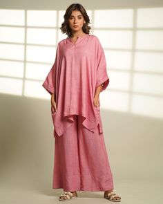 "Introducing our Linen Oversized Loungewear Set. Elevate your fall wardrobe with a comfy and stylish ensemble comprising a long-sleeve shirt and matching long pants. Crafted from linen, this set offers the perfect blend of warmth and breathability. Its loose, relaxed fit ensures all-day comfort, whether you're lounging or going out. Features two inseam pockets and customizable colour options. Length Top: 32 inches, Pant length: 39.5 inches Quality: Linen. Care: Hand wash with light detergent or dry clean. Ships within 14-21 working days. For quicker delivery please send us a message. Additional Information: Colour: Rose Water Pink (Customizable to your preference) Feel: Soft and light. Availability: Made to order. Fabric: Linen. Wash Care: Mild hand wash or dry clean recommended. Shipping: Pink Relaxed Fit Sets For Daywear, Oversized Casual Kaftan For Loungewear, Casual Oversized Kaftan For Loungewear, Relaxed Fit Pink Sets For Vacation, Pink Cotton Loungewear Sets, Oversized Long Sleeve Sets For Daywear, Oversized Spring Loungewear Sets, Pink Summer Loungewear Kimono, Pink Cotton Wide Leg Sleepwear