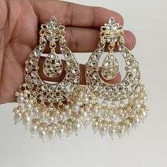 White gold Pearl Kundan chandbali Earrings, White chandbali earrings, Indian pakistani wedding jewelry, bridesmaid gift Indo Western Chand Earring With Gold Plating Product Weight = 25 grams each earring Height = 95 mm || Width = 60 mm Trendy Design Indo Western Earring Arrives in a gift box Color, shades, texture displayed may slightly vary from the actual product due to digital image limitations. We request you to consider these minor variations. Please expect the possibility of some slight imperfections when buying handmade jewelry. If you have any questions, please contact us. Luxury Fusion Style Chandbalis For Wedding, Luxury Wedding Chandbali Pearl Earrings, Luxury Chandbali Earrings For Eid, Luxury Chandbali Danglers For Anniversary, Luxury White Meenakari Bridal Earrings, Luxury Chinon Palazzo Set Chandbali Style, Luxury Pearl Drop Chandbalis For Celebration, Luxury Cutdana Chandbali Pearl Necklace, Luxury Chandbali Jewelry For Celebration