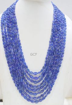 Tanzanite Smooth Oval Nuggets Shape Necklace , Tanzanite 8 Line Necklace 19 - 26 Inches Long With Adjustable Tussle ,5x6 - 9x13 mm ,31480 Stone : Tanzanite Beads Size : 5x6 - 9x13 mm approx Necklace Length : 19 - 26 Inches Weight : 1150 CT Code : BA Oval Blue Necklaces With Faceted Beads, Blue Oval Necklaces With Faceted Beads, Blue Oval Necklace With Faceted Beads, Blue Oval Faceted Necklaces, Blue Oval Faceted Necklace, Tanzanite Beads, Necklace Length, Necklace Lengths, Beaded Necklace