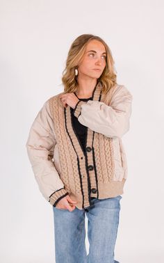 + soft taupe with black accents+ mixed media cable knit striped texturing+ quilted puffer outer+ functional button up front+ side pockets+ effortless oversized cardigan silhouette paired with the azalea denim Oversized Cardigan, Black Accents, Quilted Jacket, Cable Knit, Puffer, Mixed Media, Button Up, Cable, Media