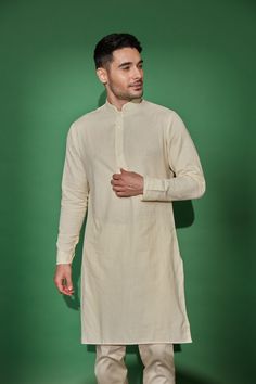 Cream banded collar linen-cotton kurta. Perfect to pair with our vests for a more traditional look Model is 5'9" (168 lbs) and is wearing a size Medium (Last pic shows contrast of the Cream kurta against our Ivory kurta) How to Wear Daytime: pair with the Cream pants for a softer toned look (sold separately) Evening: pair with the Onyx Pants (sold separately) Occassion ideas: wedding ceremony, sangeet, mehndi, Diwali, religious ceremonies Ceremony Outfit, Haldi Ceremony Outfit, Kurta Cotton, Cream Pants, Beige Shirt, Traditional Look, Religious Ceremony, Haldi Ceremony, Cotton Kurta