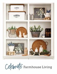 a white book shelf filled with vases and pictures