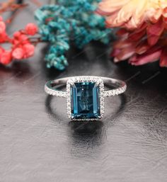 "Blue Topaz Ring, Vintage Wedding Ring, 7x9mm Emerald Cut London Blue Topaz Wedding Ring, Engagement Ring, White Gold Ring, Anniversary Gift ✿ Metal: 14K Gold (White/ Yellow/ Rose Gold), we can also make the ring in 18K gold or Platinum, contact us if you want! -----「Engagement Ring Details」----- * Center Stone: Natural London Blue Topaz  * Stone Clarity: VS * Stone Shape: Emerald Cut-7x9mm * Stone Weight: Approx. 3.00 CT * Side Stone: Approx. 0.27ctw * Moissanite: EF, VVS1 * SKU: WSNER0760-7x9mm √ CUSTOM √ PAYMENT PLAN √ ENGRAVING  Production Time  The process of making this order is 2-3 weeks for the hand made production and shipping. The reason it takes that amount of time is because I start making them from scratch once the order is received. We prefer to give my retail customers a mor Emerald Cut Aquamarine Topaz Ring For Wedding, Emerald Cut Topaz Wedding Ring With Aquamarine, Emerald Cut Topaz Wedding Ring, Blue Topaz Emerald-cut Ring For Wedding, Blue Emerald-cut Topaz Wedding Ring, Blue Emerald Cut Topaz Wedding Ring, Sapphire-colored Emerald-cut Topaz Wedding Ring, Sapphire Color Emerald-cut Topaz Wedding Ring, Sapphire Color Emerald Cut Topaz Wedding Ring