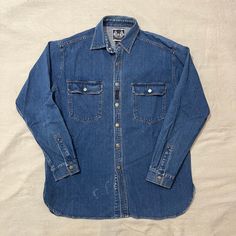 Good condition (slight paint stain shown), and measurements are shown in the pictures as well. Feel free to DM any questions! ELS1 Vintage Denim Blue Tops For Streetwear, Blue Washed Denim Top For Streetwear, Vintage Washed Blue Denim Top With Button Closure, Blue Button-up Denim Top For Streetwear, Vintage Medium Wash Denim Button-up Top, Vintage Medium Wash Button-up Denim Top, Vintage Blue Button-up Denim Top, Vintage Washed Blue Denim Top, Vintage Style Blue Denim Top